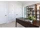 Office space featuring a dark wooden desk, and neutral walls at 809 St Charles St, Durham, NC 27713