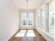 Bright sunroom featuring many windows and hardwood floors at 809 St Charles St, Durham, NC 27713