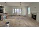 Living area with hardwood floors, fireplace, and French doors at 817 St Charles St, Durham, NC 27713