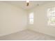 Bright bedroom with neutral carpet, two windows, and a ceiling fan at 30 Tamaran Ct, Spring Hope, NC 27882