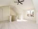 Bright bedroom featuring neutral carpet, dormer ceilings, and a ceiling fan at 30 Tamaran Ct, Spring Hope, NC 27882