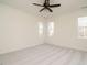 Bright bedroom with plush carpeting, neutral walls, and large windows at 30 Tamaran Ct, Spring Hope, NC 27882