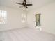 Bedroom with plush carpeting, neutral walls, and en-suite bathroom access at 30 Tamaran Ct, Spring Hope, NC 27882