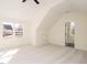 Sunlit bedroom featuring neutral carpet, an open doorway, and a window with a view at 30 Tamaran Ct, Spring Hope, NC 27882