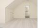 Bright bedroom featuring neutral carpet, dormer ceilings, and a window with a view at 30 Tamaran Ct, Spring Hope, NC 27882