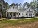 Charming single-Gathering home featuring a beautifully landscaped yard and inviting front porch at 30 Tamaran Ct, Spring Hope, NC 27882