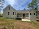 A lovely view of the home's exterior with a relaxing back porch with nature all around at 30 Tamaran Ct, Spring Hope, NC 27882