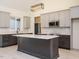 Modern kitchen with a spacious island, stainless steel appliances, and stylish backsplash at 30 Tamaran Ct, Spring Hope, NC 27882