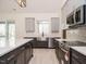 Modern kitchen with island, stainless steel appliances, and view to outdoor living space at 30 Tamaran Ct, Spring Hope, NC 27882