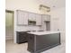 Modern kitchen featuring an island, stainless steel appliances, and stylish backsplash at 30 Tamaran Ct, Spring Hope, NC 27882