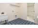 Well-lit laundry room with ample space and stylish tiled flooring at 30 Tamaran Ct, Spring Hope, NC 27882