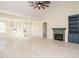 Spacious living room with white walls, fireplace, and views of the home's front yard at 30 Tamaran Ct, Spring Hope, NC 27882
