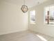 Sun-filled living room with a modern light fixture and two windows at 30 Tamaran Ct, Spring Hope, NC 27882