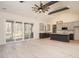 Open-concept living space with modern kitchen and sliding glass doors at 30 Tamaran Ct, Spring Hope, NC 27882