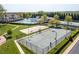 Aerial view of the community amenities: pool, tennis courts, volleyball court, and playground at 3102 Castlerock Dr # 2, Burlington, NC 27215