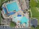 Aerial view of the community pool area with lap pool and leisure pool with waterslide at 3102 Castlerock Dr # 2, Burlington, NC 27215