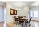 Dining room with a wooden table, seating for six, and elegant lighting fixture at 3102 Castlerock Dr # 2, Burlington, NC 27215