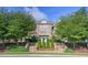Stone home featuring manicured landscaping, symmetrical design, and a welcoming entrance at 3102 Castlerock Dr # 2, Burlington, NC 27215