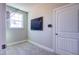 Well-lit hallway with tiled floor, decorative wall art, and ample storage space at 3102 Castlerock Dr # 2, Burlington, NC 27215