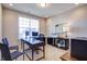 Bright home office featuring a modern desk, comfortable chairs, and natural light at 3102 Castlerock Dr # 2, Burlington, NC 27215
