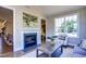 Cozy living room with a fireplace, comfortable seating, and views of the backyard at 3102 Castlerock Dr # 2, Burlington, NC 27215