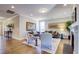 Light-filled living room offers hardwood floors, comfortable seating, and views of the surrounding landscape at 3102 Castlerock Dr # 2, Burlington, NC 27215