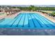 Community pool with lap lanes, pergola, and ample lounge seating near the clubhouse at 3102 Castlerock Dr # 2, Burlington, NC 27215