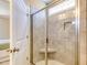 Walk-in shower has a glass enclosure, built-in bench, and tiled walls at 3102 Castlerock Dr # 2, Burlington, NC 27215