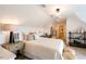 Charming bedroom with sloped ceilings and built-in shelving at 1005 Bridgeforth Ln, Chapel Hill, NC 27517