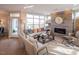 Bright living room featuring a fireplace and access to a back patio at 1005 Bridgeforth Ln, Chapel Hill, NC 27517
