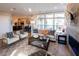 Open living space with a fireplace and views into the kitchen and dining area at 1005 Bridgeforth Ln, Chapel Hill, NC 27517