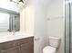 Bathroom with sleek vanity, modern fixtures, and glass enclosed shower at 1000 Azalea Garden Circle, Raleigh, NC 27603