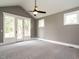 Spacious bedroom featuring a ceiling fan and a private entrance to the outdoors at 1000 Azalea Garden Circle, Raleigh, NC 27603