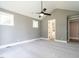 Comfortable bedroom featuring plush carpeting, a contemporary ceiling fan, and an en-suite bathroom at 1000 Azalea Garden Circle, Raleigh, NC 27603