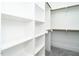 Spacious walk-in closet with built-in shelving and hanging rods, offering ample storage solutions at 1000 Azalea Garden Circle, Raleigh, NC 27603