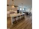 Bright kitchen featuring an island with bar stool seating and stainless steel appliances at 1000 Azalea Garden Circle, Raleigh, NC 27603
