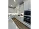 Bright kitchen featuring an island with bar stool seating and stainless steel appliances at 1000 Azalea Garden Circle, Raleigh, NC 27603