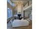 Spacious living room with large windows, fireplace, and an upper level view at 1000 Azalea Garden Circle, Raleigh, NC 27603