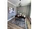 A modern office space featuring gray walls, a black desk and an open book at 1000 Azalea Garden Circle, Raleigh, NC 27603