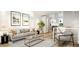 Open concept living room features a large couch, modern decor, and an open view to the kitchen at 106 Broadway St # 202, Durham, NC 27701