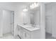 Bathroom with double vanity, modern lighting, and neutral paint at 736 Heathered Farm Way, Apex, NC 27523