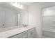Bright bathroom featuring a single vanity sink, chrome hardware, and a shower and tub combo at 736 Heathered Farm Way, Apex, NC 27523