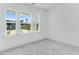 Cozy bedroom with three windows, carpeted floor and white walls at 736 Heathered Farm Way, Apex, NC 27523