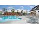 Beautiful community pool with ample seating, modern lounge chairs, and stylish wooden pergola structures for relaxation at 736 Heathered Farm Way, Apex, NC 27523