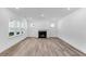 Bright living room with fireplace, recessed lights and large windows at 736 Heathered Farm Way, Apex, NC 27523