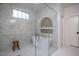 Beautiful bath featuring large walk-in shower with marble tile and soaking tub at 1000 Marilyn Dr, Raleigh, NC 27607