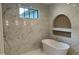 Luxurious bathroom featuring a freestanding tub, marble tile, and modern fixtures at 1000 Marilyn Dr, Raleigh, NC 27607