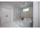 Luxury bathroom with a glass shower and a freestanding tub with marble tile at 1000 Marilyn Dr, Raleigh, NC 27607
