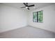 Cozy bedroom with neutral walls, carpet, ceiling fan, and a window to let natural light in at 1000 Marilyn Dr, Raleigh, NC 27607