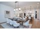 Open concept dining room with seating for eight and views of the kitchen at 1000 Marilyn Dr, Raleigh, NC 27607